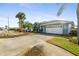 Single Gathering home with a two car garage and manicured lawn at 8540 Caitlin Ct, Hudson, FL 34667