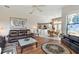 Comfortable living room with hardwood floors and views into the kitchen and dining areas at 8540 Caitlin Ct, Hudson, FL 34667