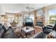 Open living area with hardwood floors, fireplace, and a view into the kitchen at 8540 Caitlin Ct, Hudson, FL 34667