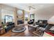 Relaxing living room with a fireplace, hardwood floors, and comfortable seating at 8540 Caitlin Ct, Hudson, FL 34667