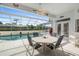 Enjoy dining alfresco in this screened pool area at 8540 Caitlin Ct, Hudson, FL 34667