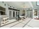 Covered patio with outdoor seating and pool access at 8540 Caitlin Ct, Hudson, FL 34667