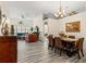 Elegant dining room featuring a wood table and wicker chairs at 9202 Fawn Crossings Ct, Tampa, FL 33626