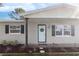 Charming home with a covered entryway and landscaping at 9240 Whitman Ln, Port Richey, FL 34668