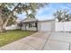 Newly renovated home with a landscaped yard at 9240 Whitman Ln, Port Richey, FL 34668