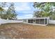 House exterior with backyard showcasing fenced-in area at 9240 Whitman Ln, Port Richey, FL 34668