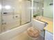 Clean bathroom with a tub and shower combination at 9327 Whitstone Ct, New Port Richey, FL 34655