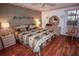 Spacious bedroom with wood floors and a king-size bed at 9327 Whitstone Ct, New Port Richey, FL 34655