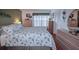 Bright bedroom with a bed featuring a seashell pattern comforter and pillows at 9327 Whitstone Ct, New Port Richey, FL 34655