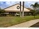 Community clubhouse with landscaping and holiday decor at 9327 Whitstone Ct, New Port Richey, FL 34655