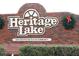 Entrance sign for Heritage Lake, a 55+ deed restricted community at 9327 Whitstone Ct, New Port Richey, FL 34655