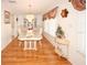 Dining room with hardwood floors, a china cabinet, and a table set for a meal at 9327 Whitstone Ct, New Port Richey, FL 34655