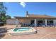 Relaxing hot tub area near the pool and lounge chairs at 9327 Whitstone Ct, New Port Richey, FL 34655