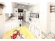 Kitchen with white cabinets, hexagonal flooring, and a breakfast nook at 9327 Whitstone Ct, New Port Richey, FL 34655