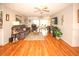 Spacious living room with hardwood floors, a TV, and access to the back patio at 9327 Whitstone Ct, New Port Richey, FL 34655