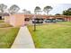 Covered carport parking with additional guest parking nearby at 9327 Whitstone Ct, New Port Richey, FL 34655