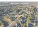 An aerial view of a neighborhood surrounded by trees at 9376 Bearwalk Path, Weeki Wachee, FL 34613