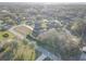 Peaceful neighborhood showcasing well-kept homes surrounded by mature trees and lush green lawns for serene living at 9376 Bearwalk Path, Weeki Wachee, FL 34613