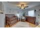 Spacious Bedroom with crib, dresser, and calming decor at 9376 Bearwalk Path, Weeki Wachee, FL 34613
