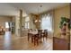 Dining room featuring a chandelier and large window, adjacent to the entry area at 9376 Bearwalk Path, Weeki Wachee, FL 34613