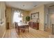 Dining room featuring a chandelier and large window, adjacent to the sideboard at 9376 Bearwalk Path, Weeki Wachee, FL 34613