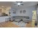 Living room boasts an open design, connecting seamlessly to the kitchen and dining area at 9376 Bearwalk Path, Weeki Wachee, FL 34613