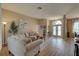 Spacious living room leading to an entry foyer and dining area, with natural light at 9376 Bearwalk Path, Weeki Wachee, FL 34613