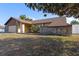 Single-story home with stone accents and a two-car garage at 9470 Montebello Ln, Spring Hill, FL 34608