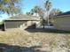 Screened patio in backyard, offering extra outdoor space at 9520 Highland Ridge Dr, Hudson, FL 34667