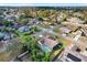 Aerial view showing home's location in a residential neighborhood with pool at 10244 Gifford Dr, Spring Hill, FL 34608