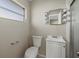Bathroom with toilet, vanity, mirror with lights and shower at 106 Aurora E St, Venice, FL 34285
