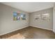 Bright bedroom with natural light, showcasing neutral walls and laminate flooring at 106 Aurora E St, Venice, FL 34285