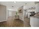 Open concept living and kitchen area featuring wood-look floors at 106 Aurora E St, Venice, FL 34285