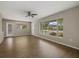 Bright and airy living room with updated flooring and view to neighborhood at 106 Aurora E St, Venice, FL 34285