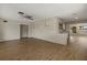 Open concept living area featuring modern flooring and brick accent wall at 106 Aurora E St, Venice, FL 34285