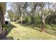 Spacious backyard with lush lawn and fenced perimeter at 11202 Paradise Point Way, New Port Richey, FL 34654