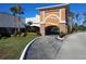 Attractive community entrance with palm trees at 11732 Carissa Ln # B, New Port Richey, FL 34654