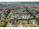 Wide aerial view of a waterfront residential neighborhood and canal homes with boat docks at 13802 Judy Ave, Hudson, FL 34667