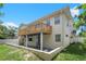 Two story house with a deck, and fenced backyard at 15806 Adobe Dr, Hudson, FL 34667