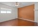 Spacious bedroom with ceiling fan and terracotta tile floor at 15806 Adobe Dr, Hudson, FL 34667