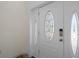 White front door with oval glass windows at 15806 Adobe Dr, Hudson, FL 34667