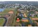 Aerial view showing condo location near school and canal at 1701 Pinehurst Rd # 9-H, Dunedin, FL 34698