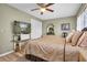 Spacious bedroom with large TV and ample closet space at 1701 Pinehurst Rd # 9-H, Dunedin, FL 34698