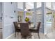 Cozy dining area with large windows and a view of the outdoor pool at 18242 Autumn Lake Blvd, Hudson, FL 34667