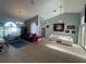 Spacious living room features high ceilings, neutral paint, tile flooring, and plenty of natural light at 18242 Autumn Lake Blvd, Hudson, FL 34667
