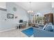 Inviting room with a desk, blue rug, and window with a decorative monogram at 18242 Autumn Lake Blvd, Hudson, FL 34667