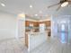 Kitchen with granite countertops, wood cabinets, and an island at 2518 Grey Dove Ct, Holiday, FL 34691