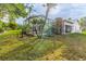 Backyard with patio and tropical plants at 2647 Royal Ridge Dr, Spring Hill, FL 34606