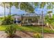 Backyard view of home and screened patio at 2647 Royal Ridge Dr, Spring Hill, FL 34606