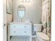 Clean bathroom with white vanity, toilet and shower at 2647 Royal Ridge Dr, Spring Hill, FL 34606